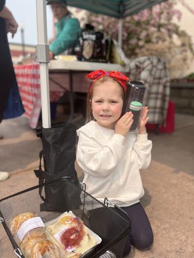A young girl enjoys macarons